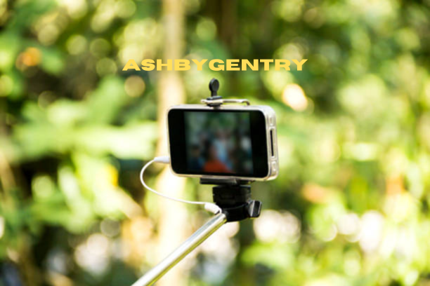 Muddy16MP trail camera connected to a smartphone in a forest setting.