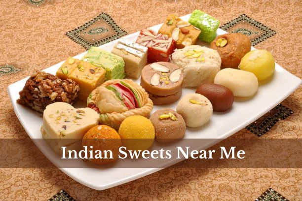 A selection of traditional Indian sweets displayed on a festive platter.