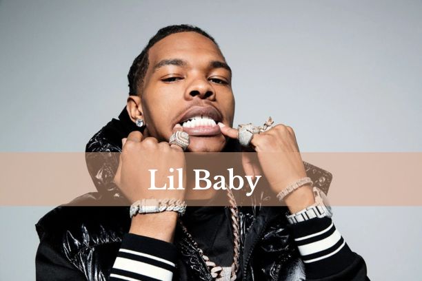 Lil Baby performing on stage, showcasing his energetic presence.